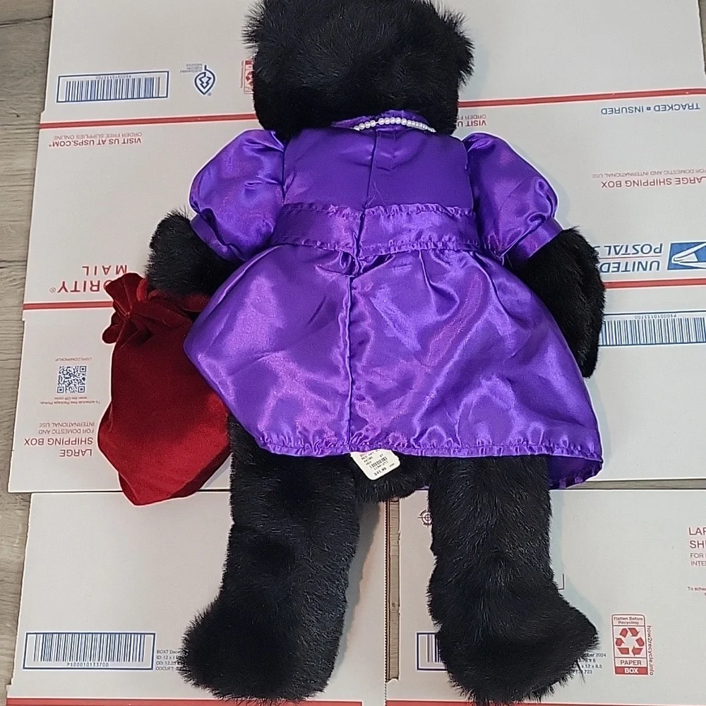 Bronner's Ditz Design Plush Bear wearing pearls and purple dress